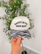 HAPPY IS THE NEW RICH trucker hat